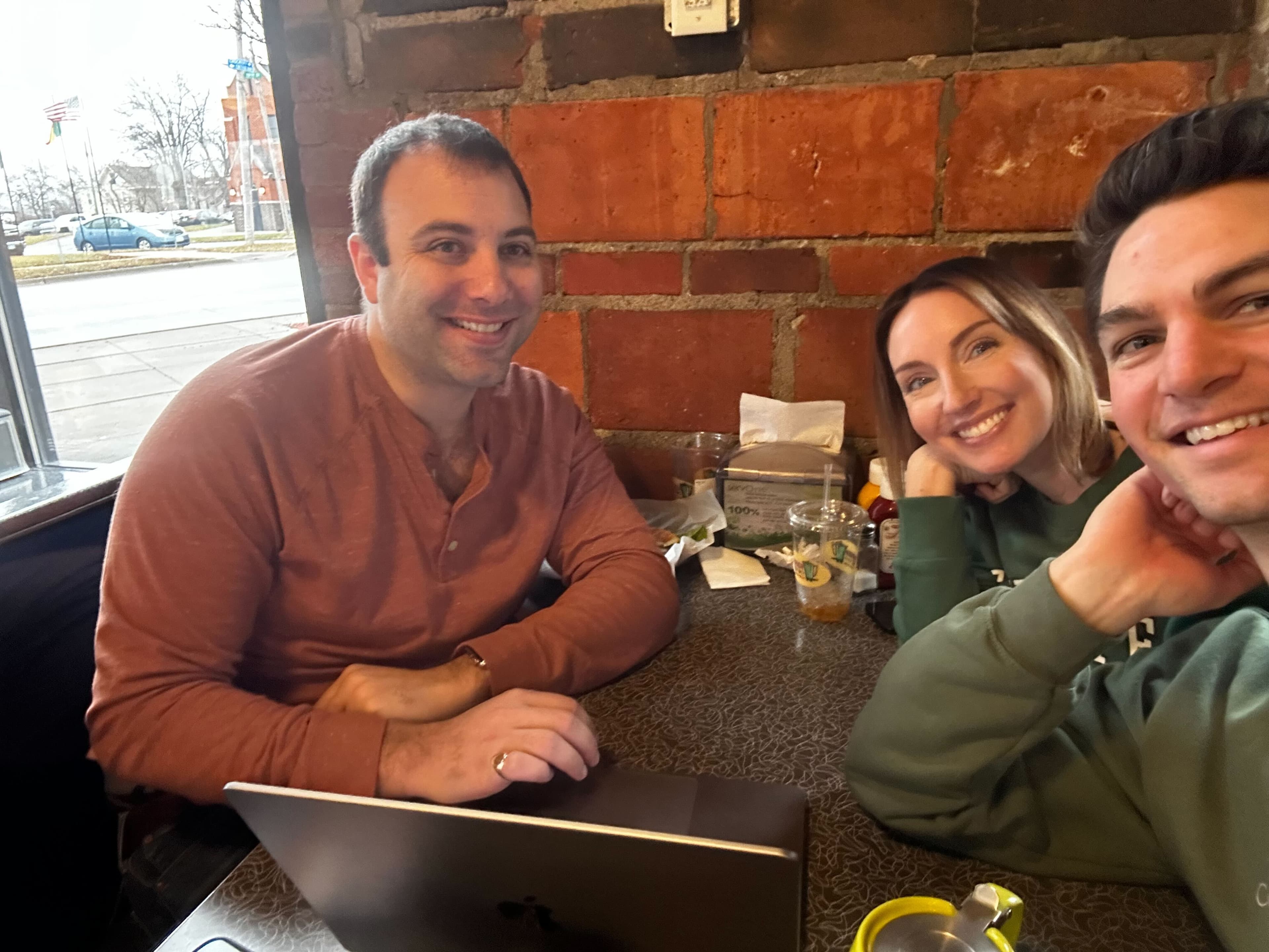 Brad, Kate, and Joseph sharing a meal